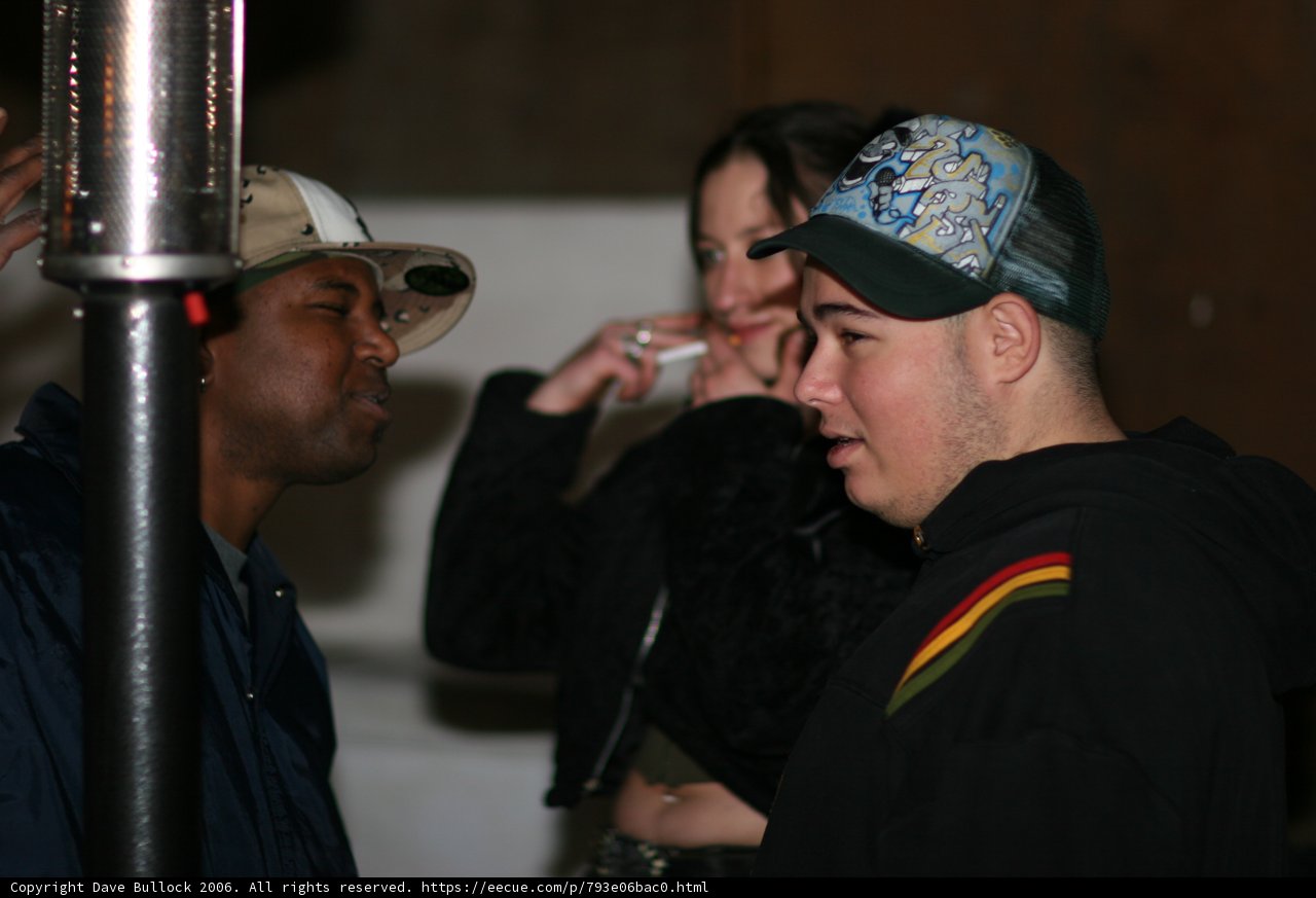 Black Jacket, Two Hats, and Four People