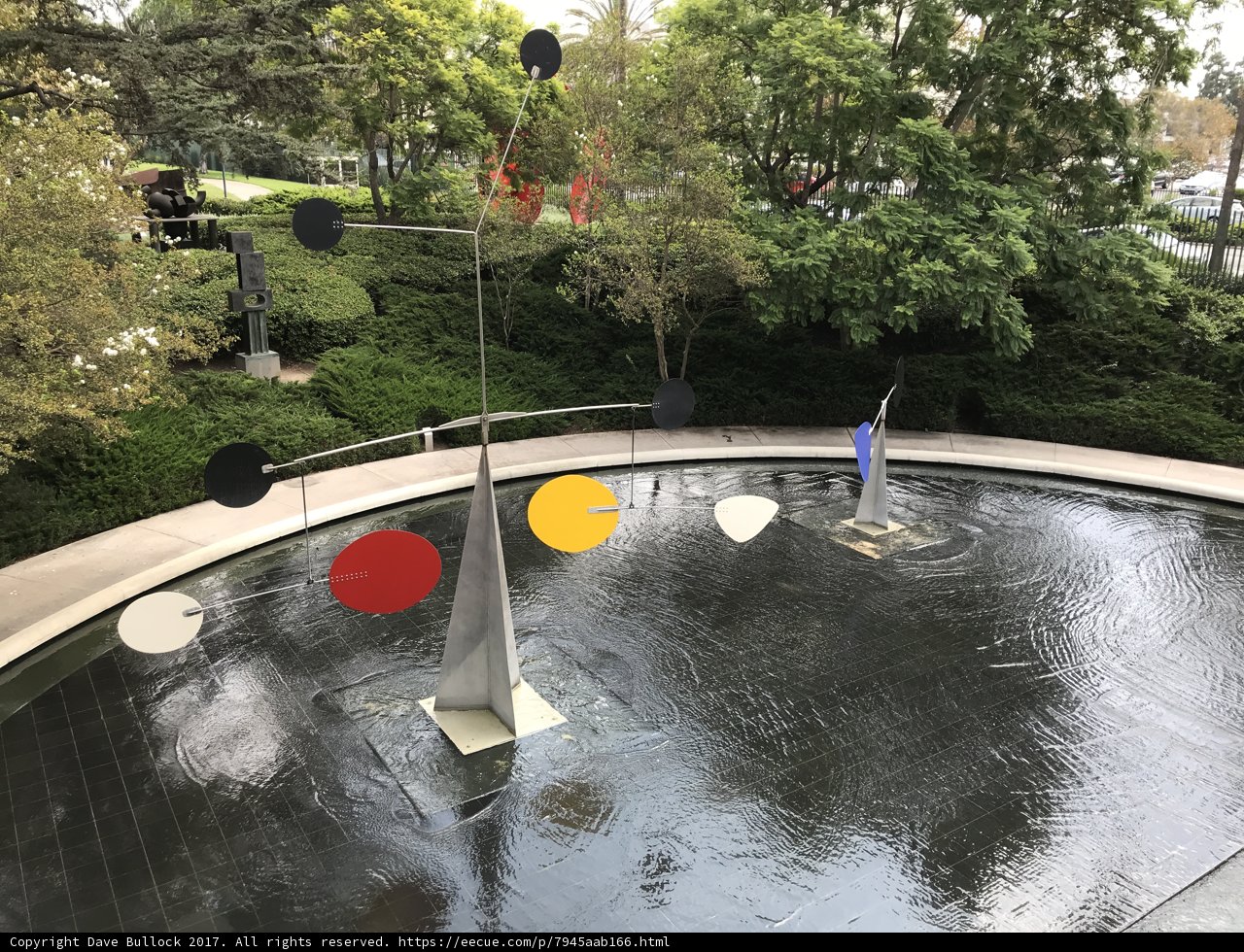 Colorful Sculpture in the Middle of a Pond