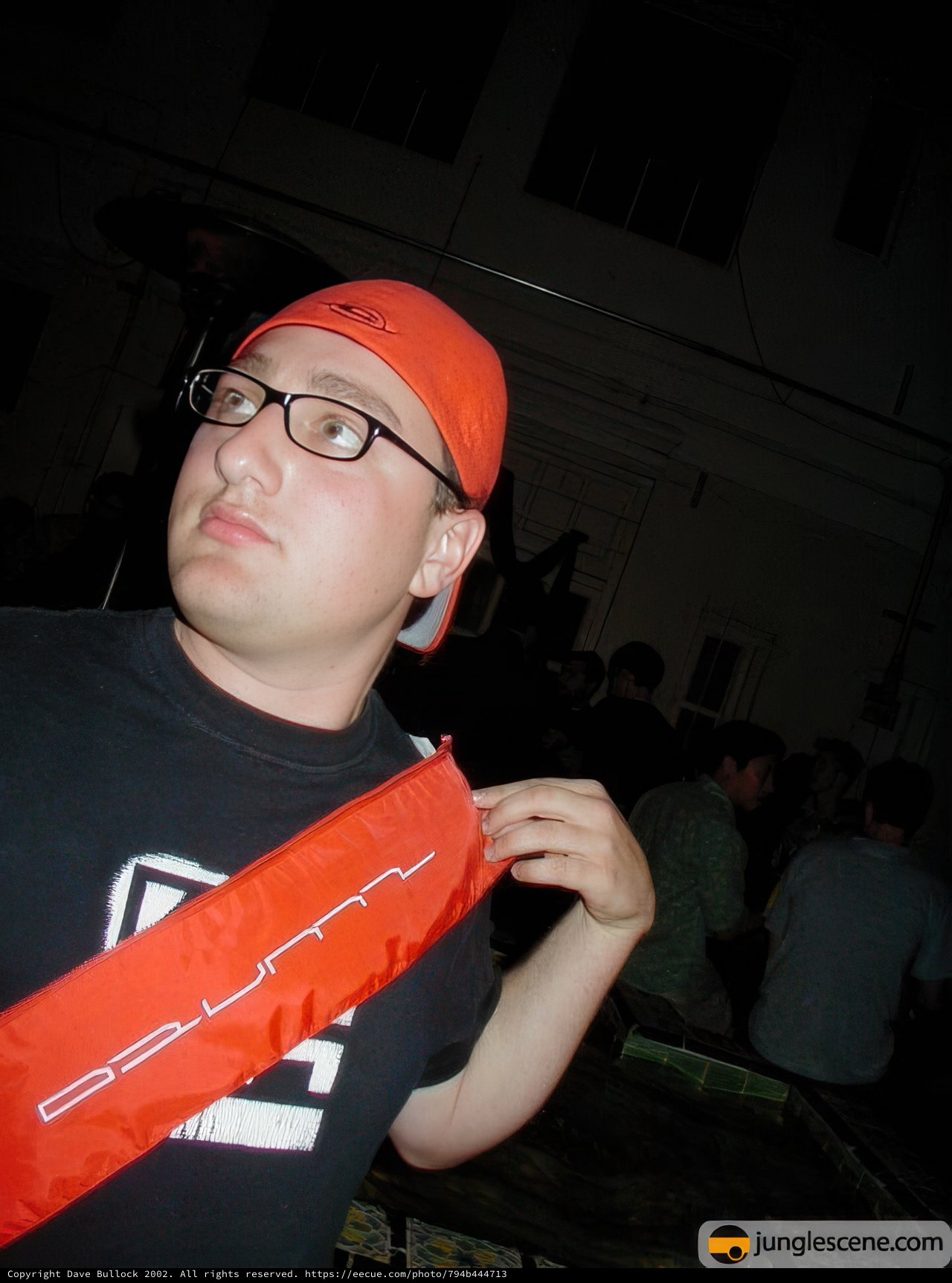 Urban Portrait of a Man in Glasses and Baseball Cap