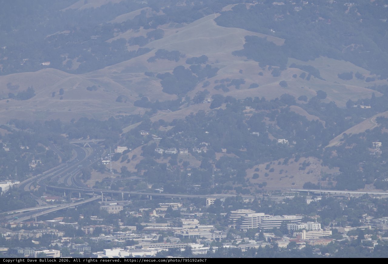 Smoky Haze Over Bay Area Freeway Interchange and Hills