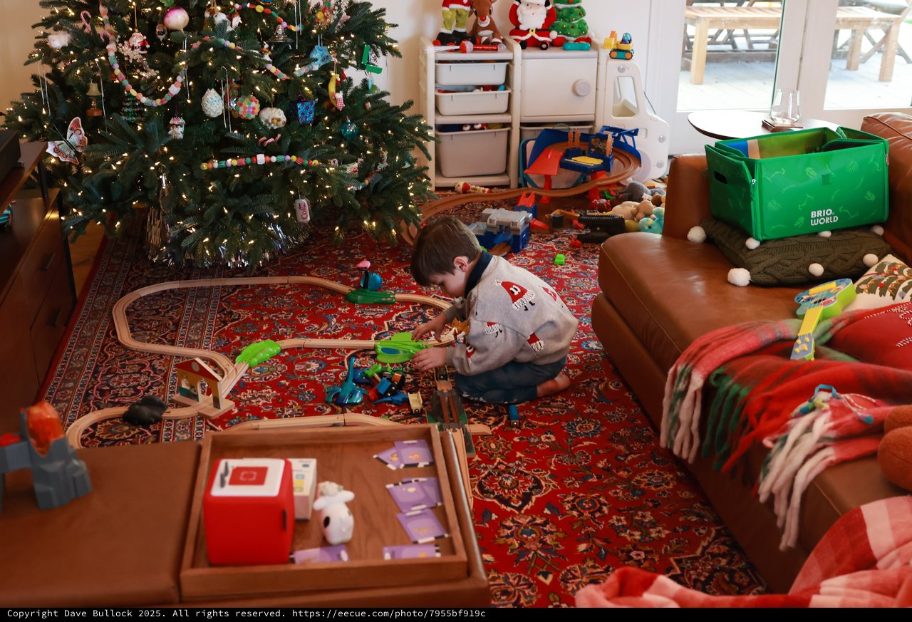 Child Playing with Train Set on Christmas Morning