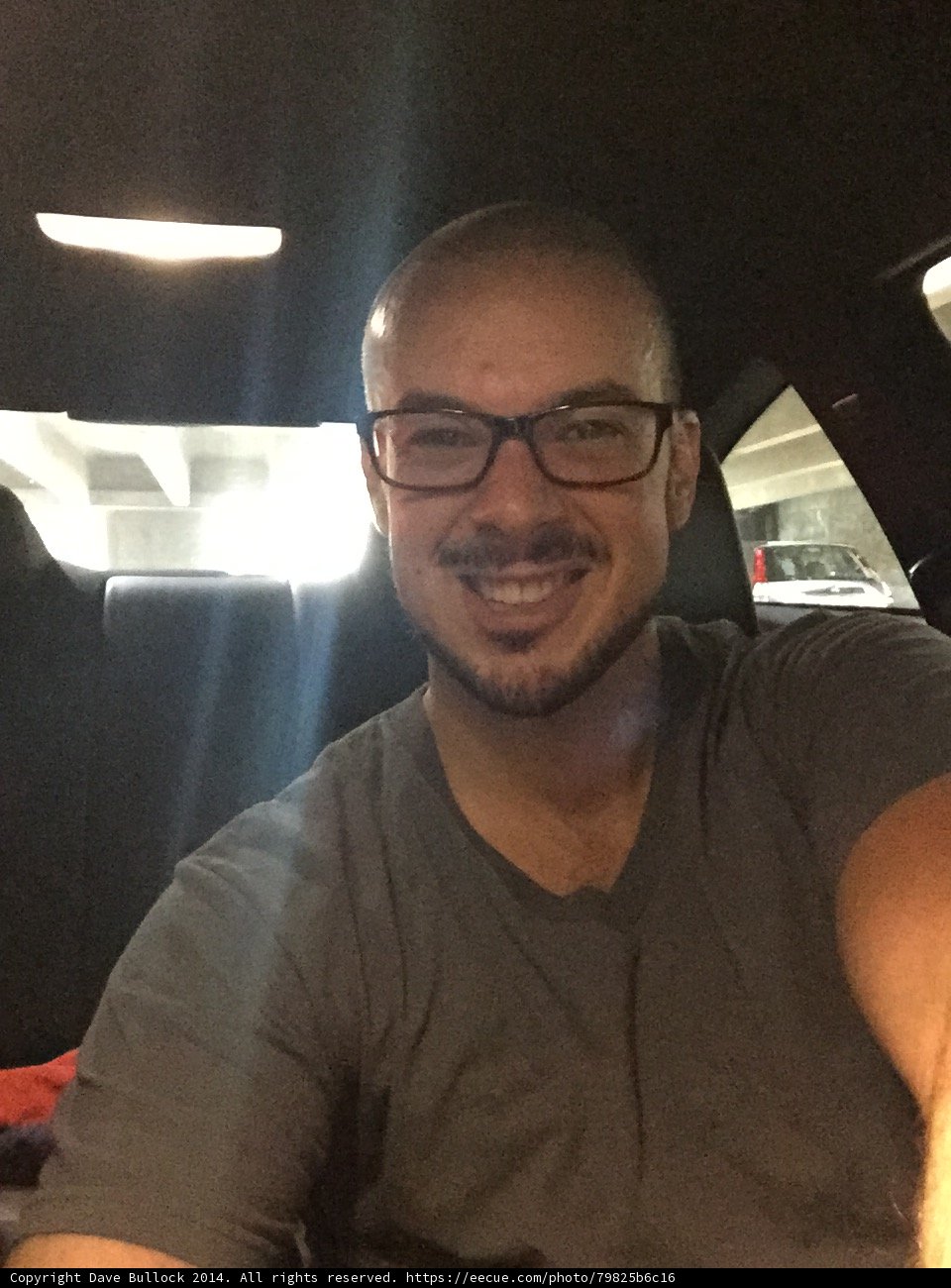 Smiling Dave B in Gray Shirt and Glasses