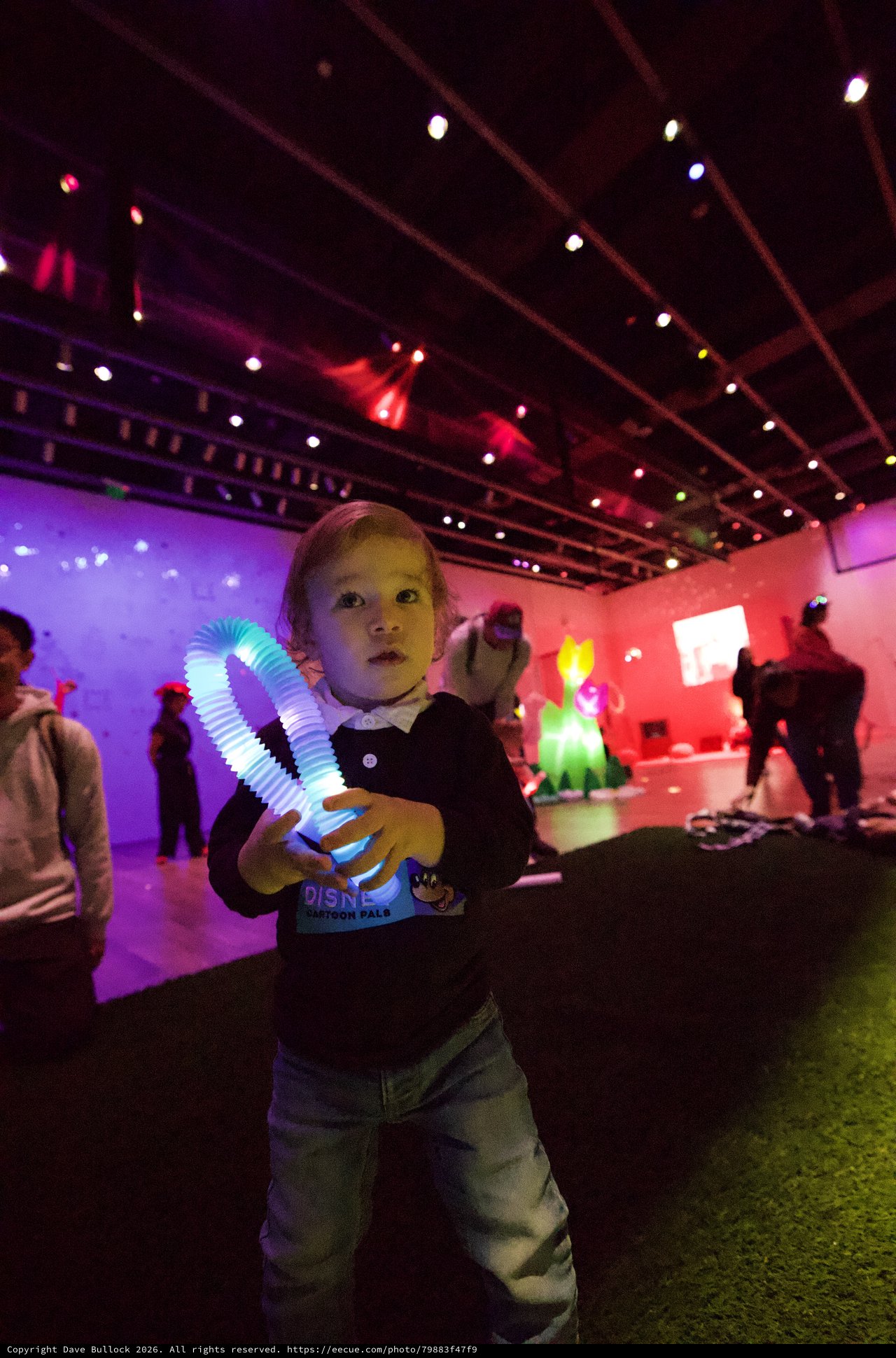 Child with Light Toy at Baby Rave Event