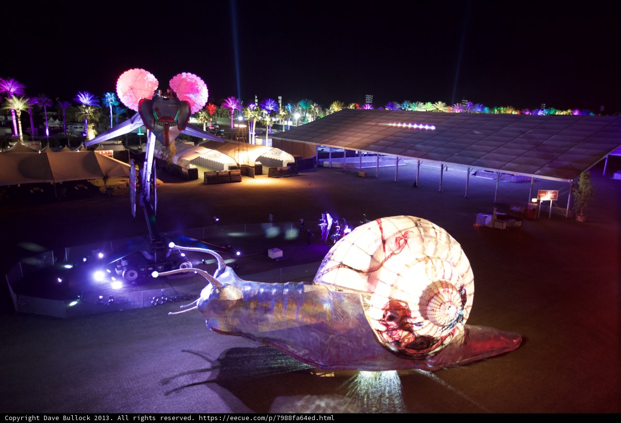 Illuminated Snail Sculpture Shines Bright in Night Sky