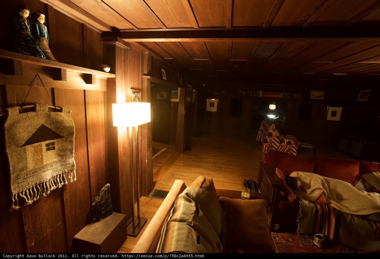 Cozy Living Room with Wooden Furniture and Soft Lighting