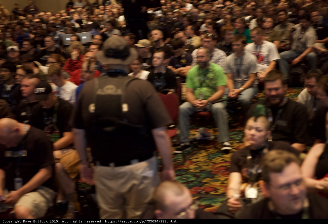 Man Commanding Attention of Large Crowd