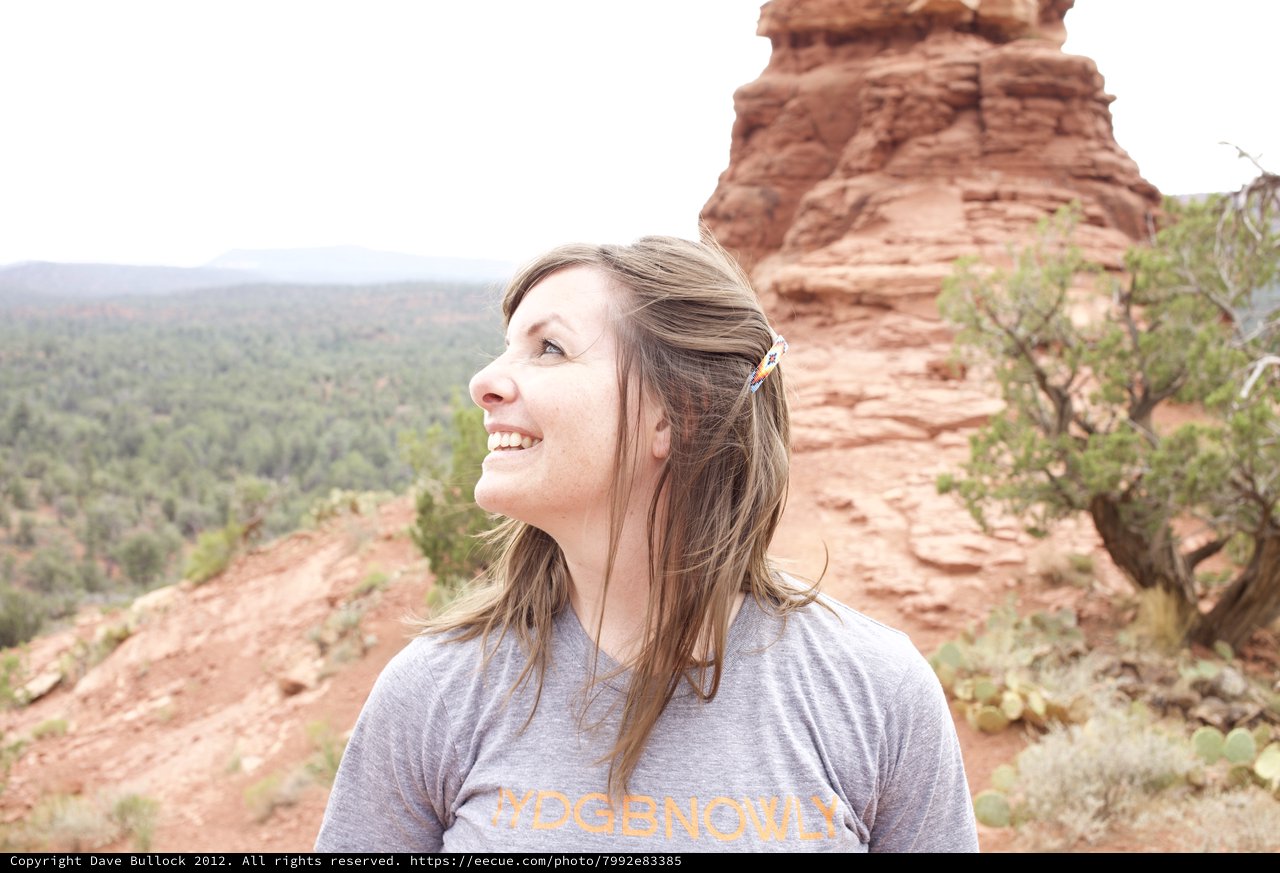 Joyful Woman Gazing Up at Sedona Red Rocks