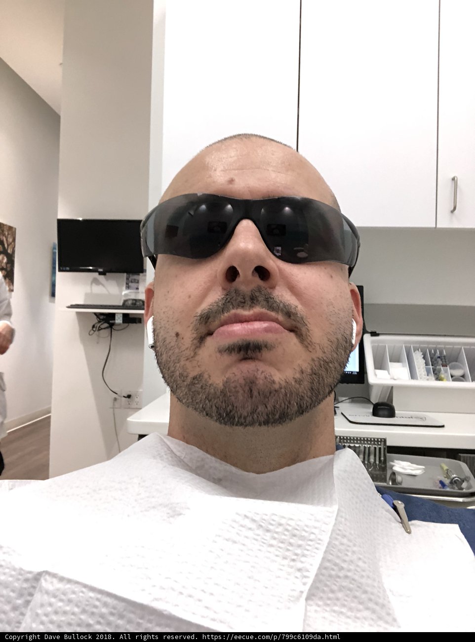 Man with Sunglasses Waiting in Dental Office