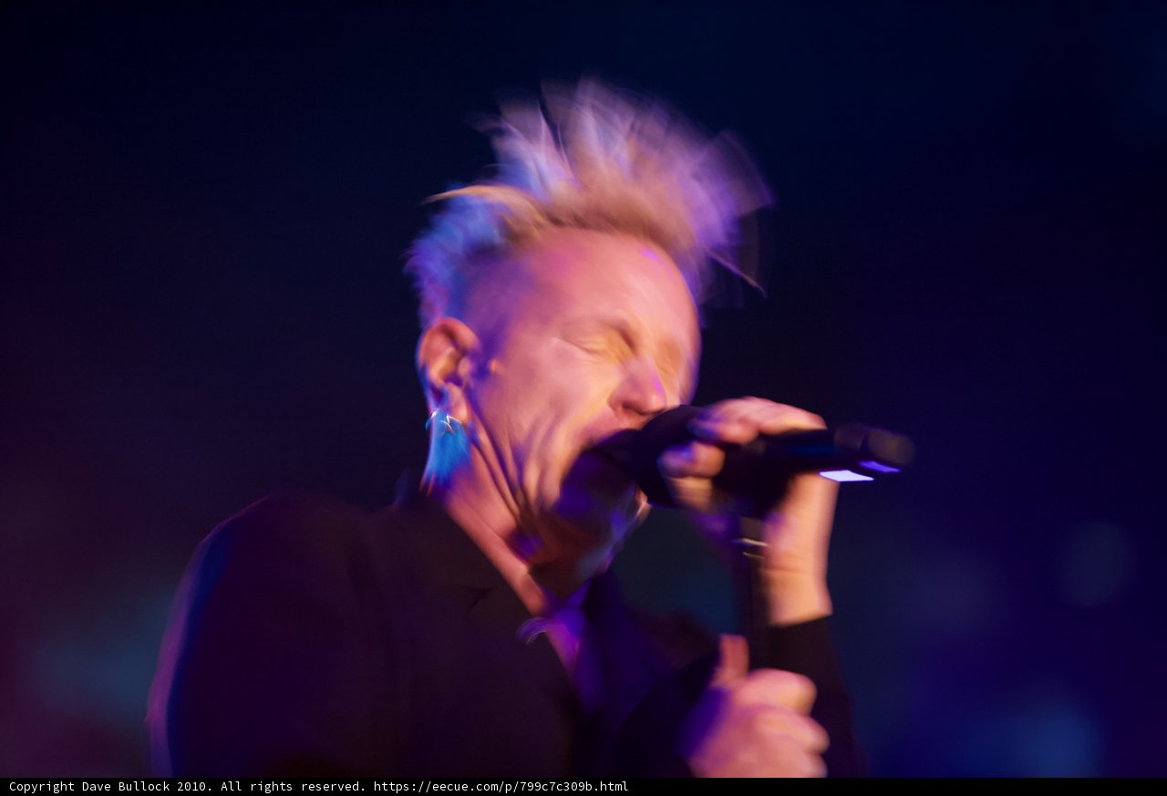 Mohawked Entertainer Belting Out a Tune