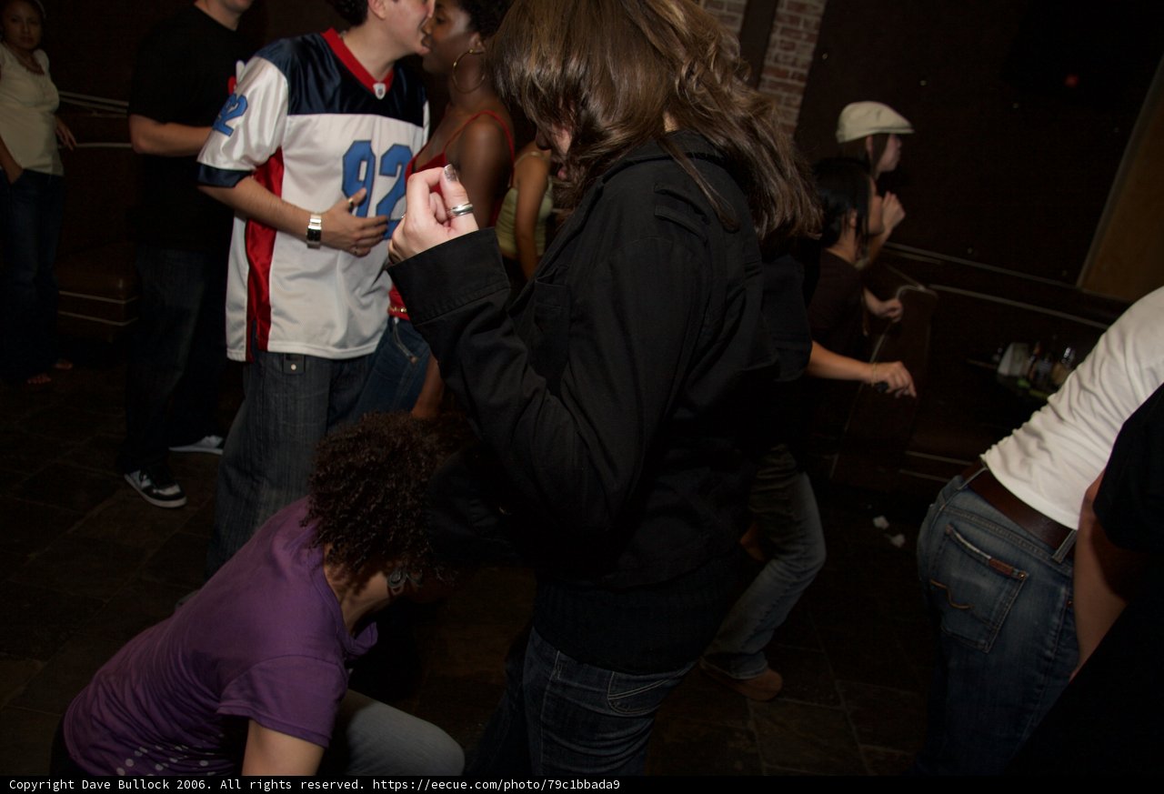 Woman in Black Shirt Enjoying Nightlife