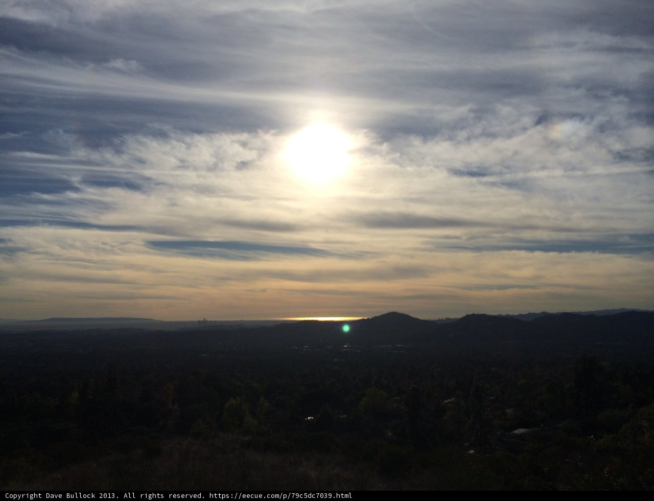 Radiant Sun over the Hillside Lake