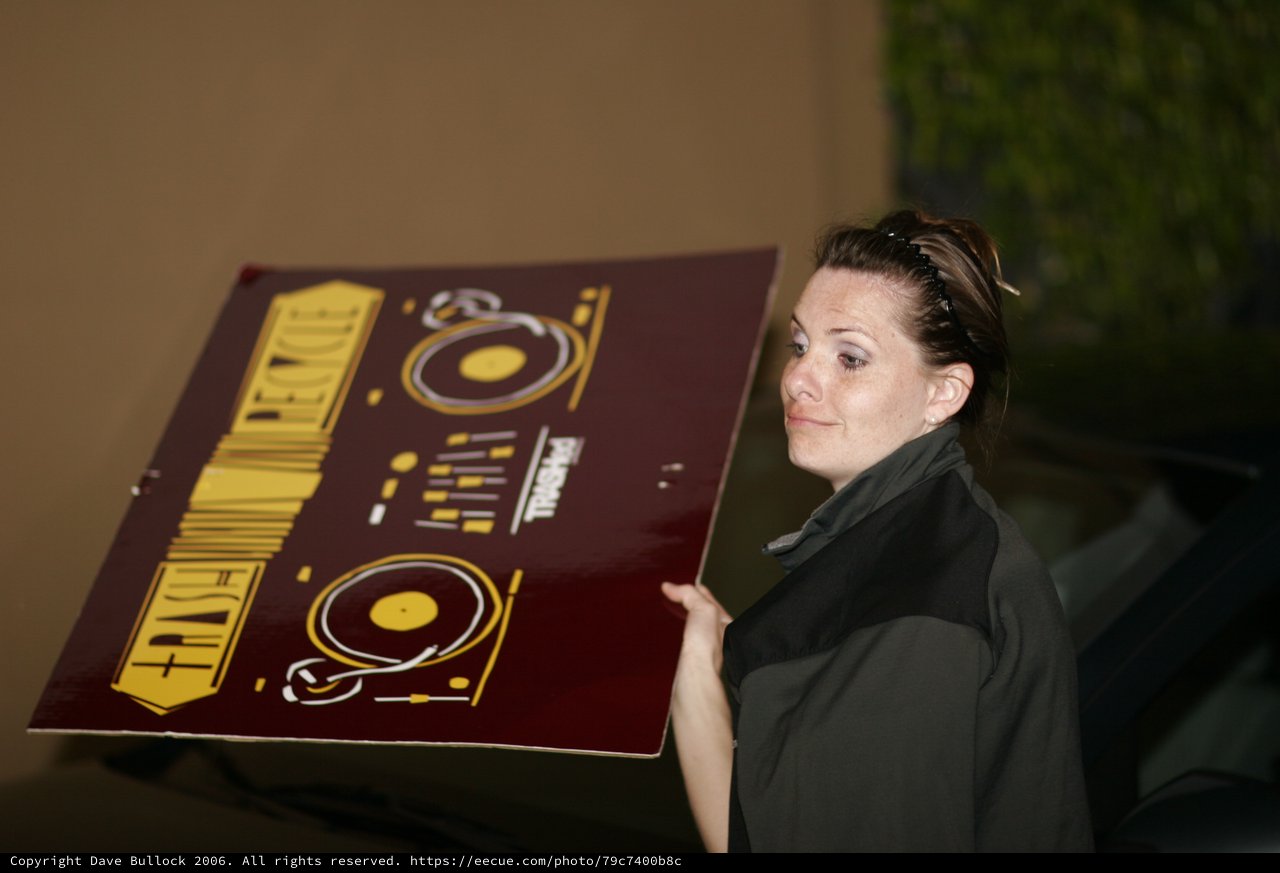 Woman Carries DJ Equipment Promotional Poster Outdoors