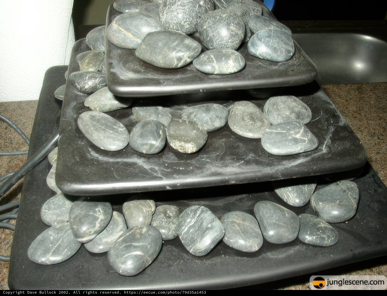 Balanced Stones on Black Tray