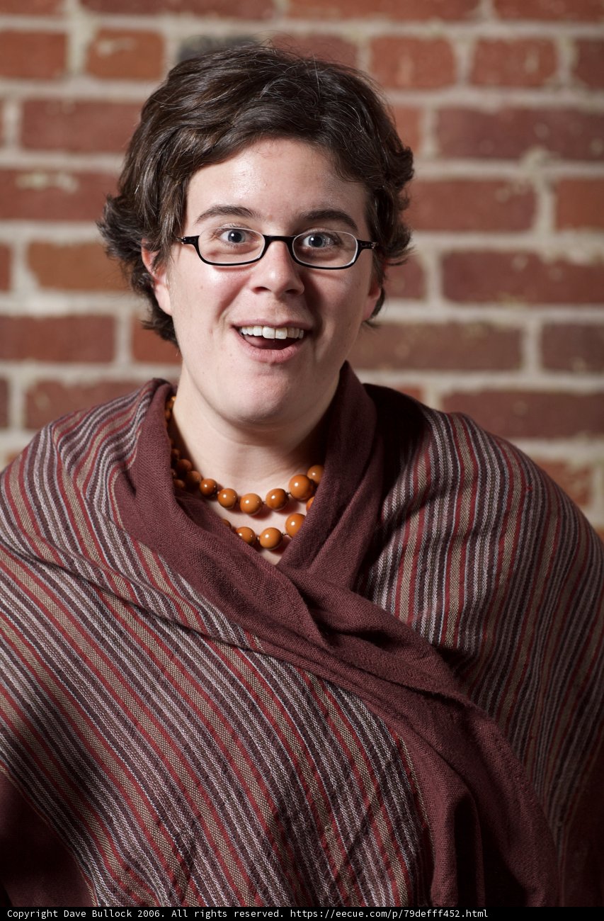 Happy Portrait of a Woman with Glasses and a Scarf