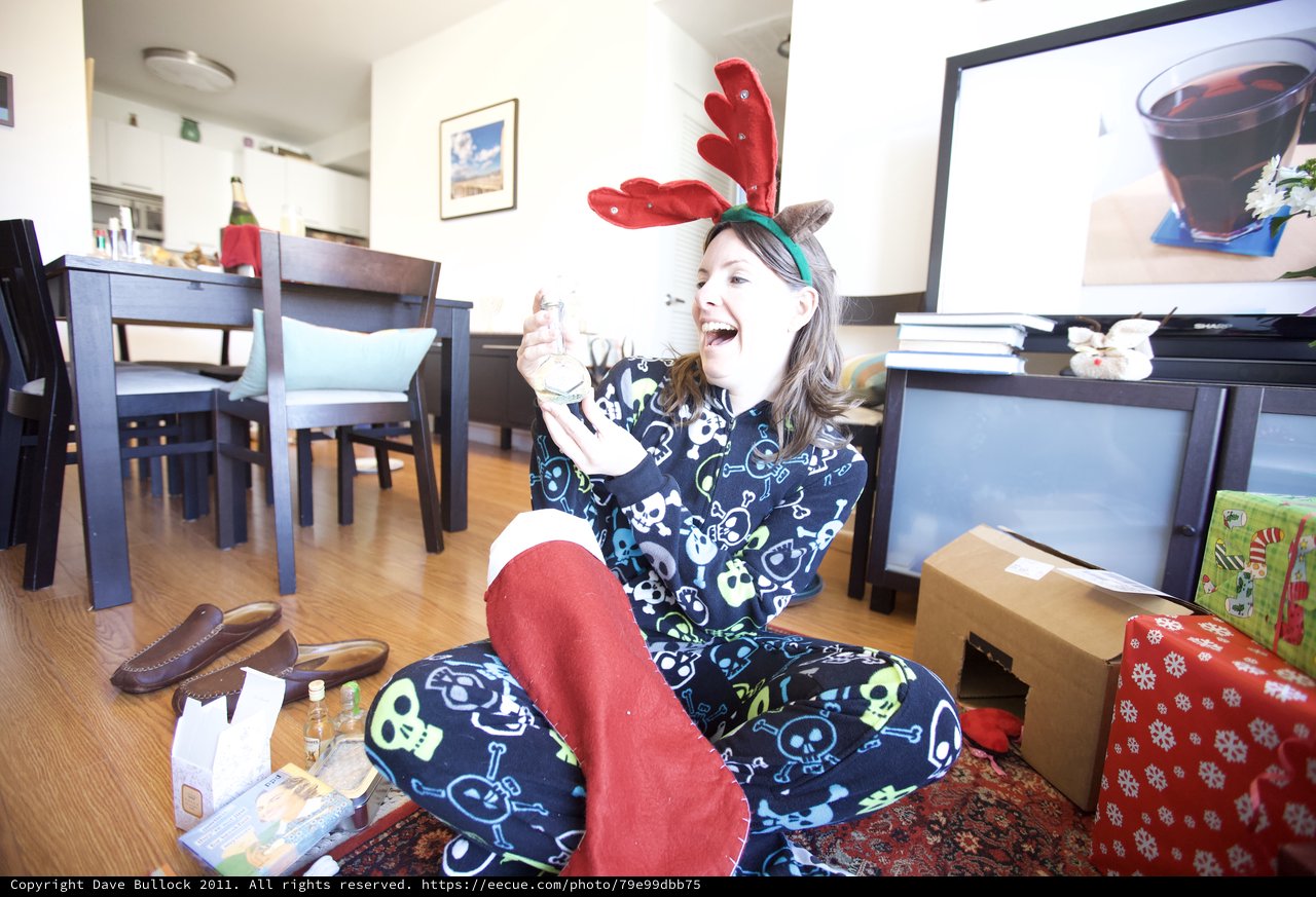 Joyful Christmas Morning in Reindeer Pajamas and Antlers
