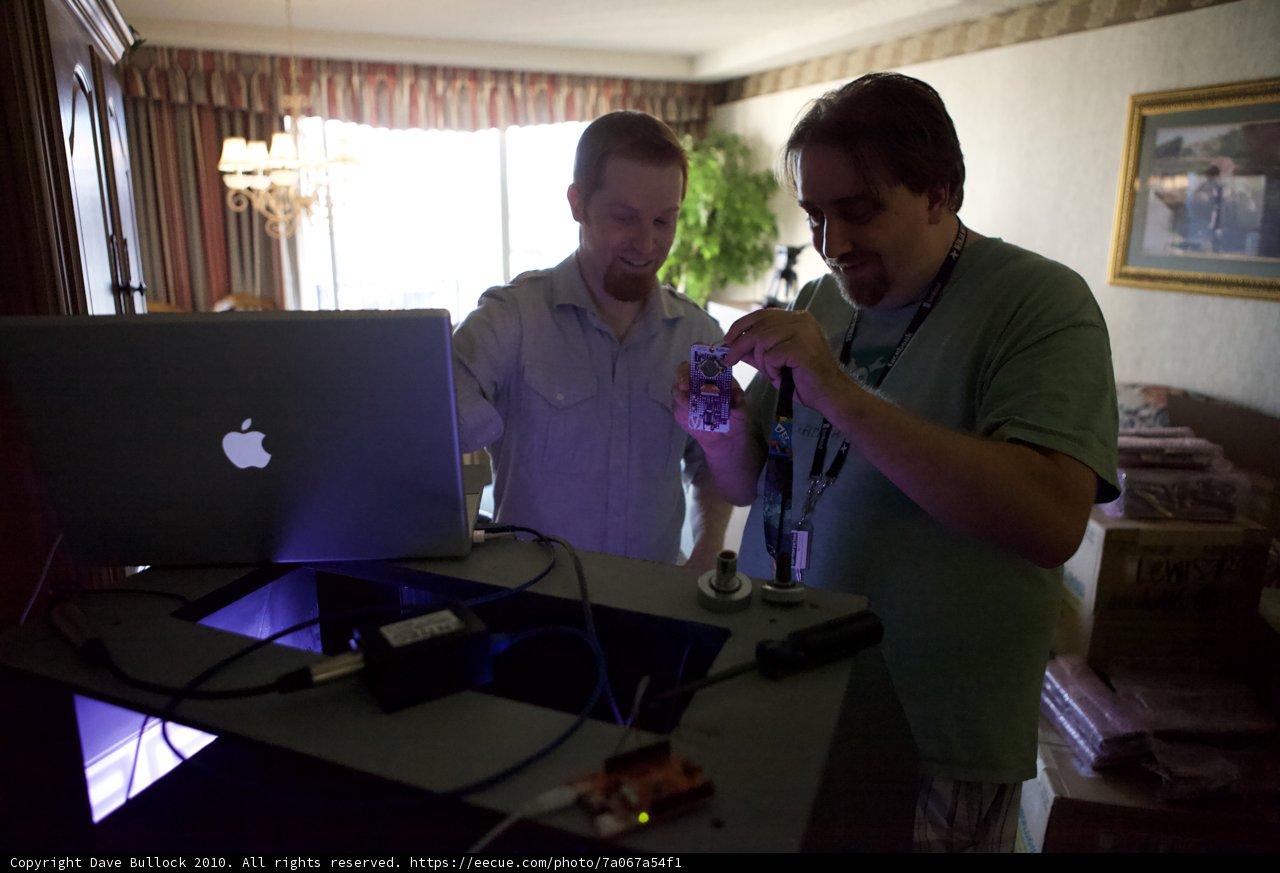 Two Men Working on Laptops