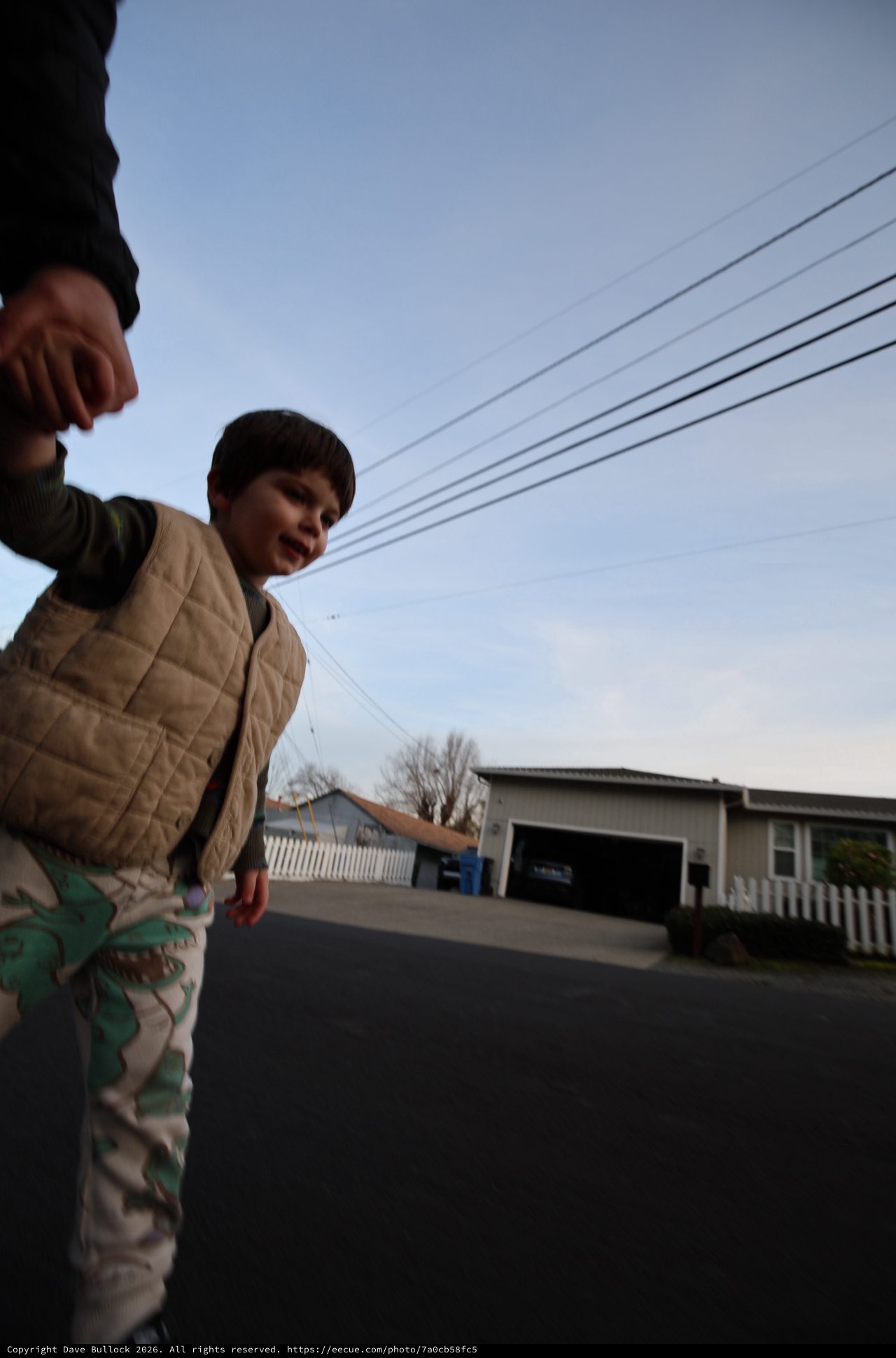 Low Angle Portrait of Child in Suburban Street