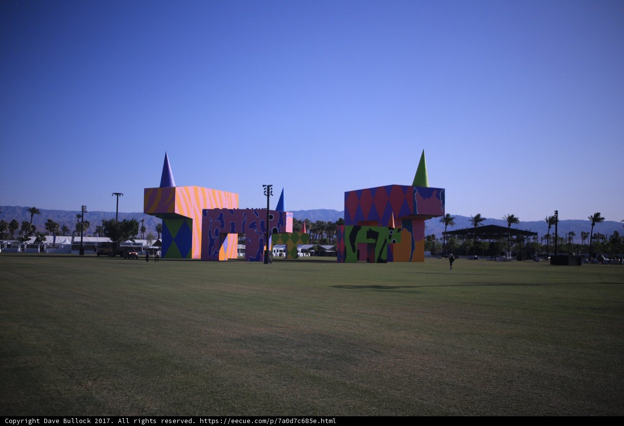 Colorful Buildings in a Vast Green Field