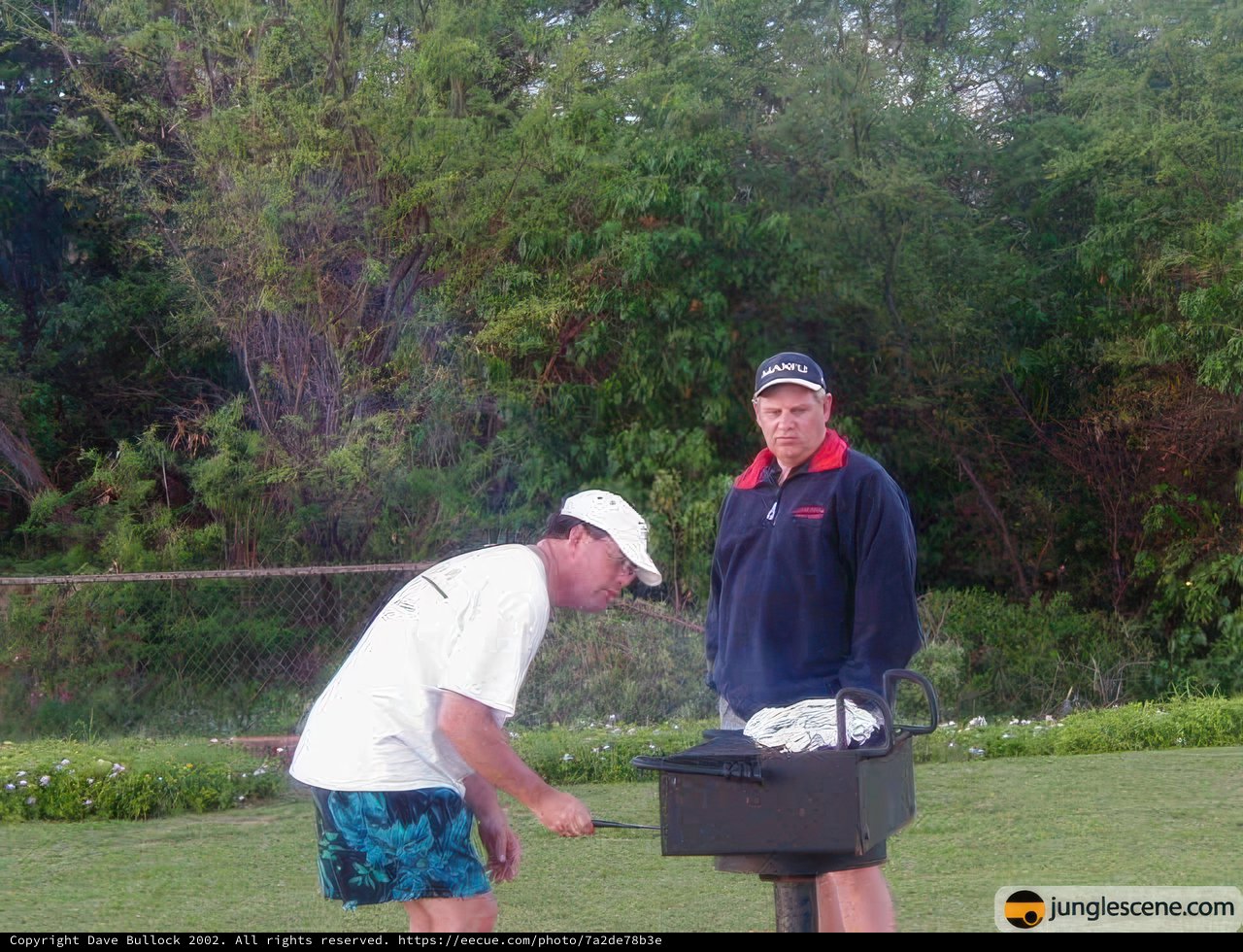 Two Men Enjoying a BBQ in the Hawaiian Sun