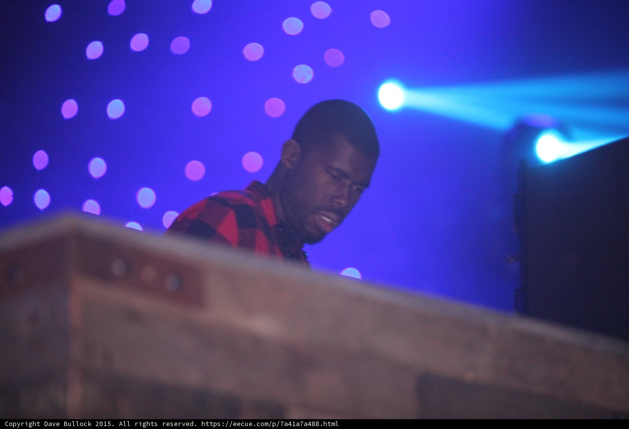 DJ Smiling at Controls