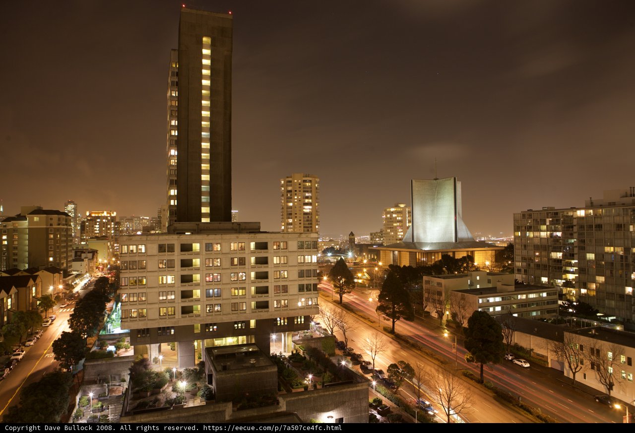 Nighttime Cityscape with High Rise Buildings and Cars