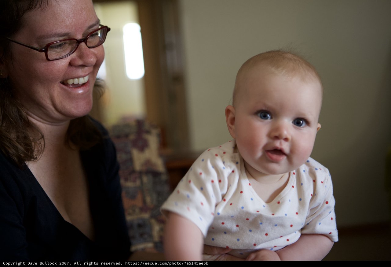 Joyful Mother and Curious Baby Share a Moment
