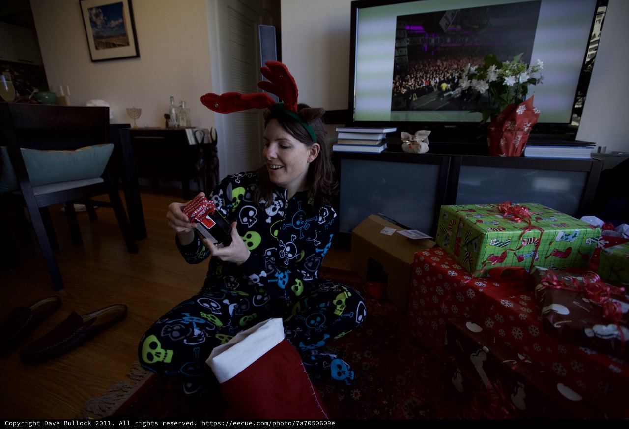 Joyful Christmas Morning Gift Opening in Reindeer Pajamas