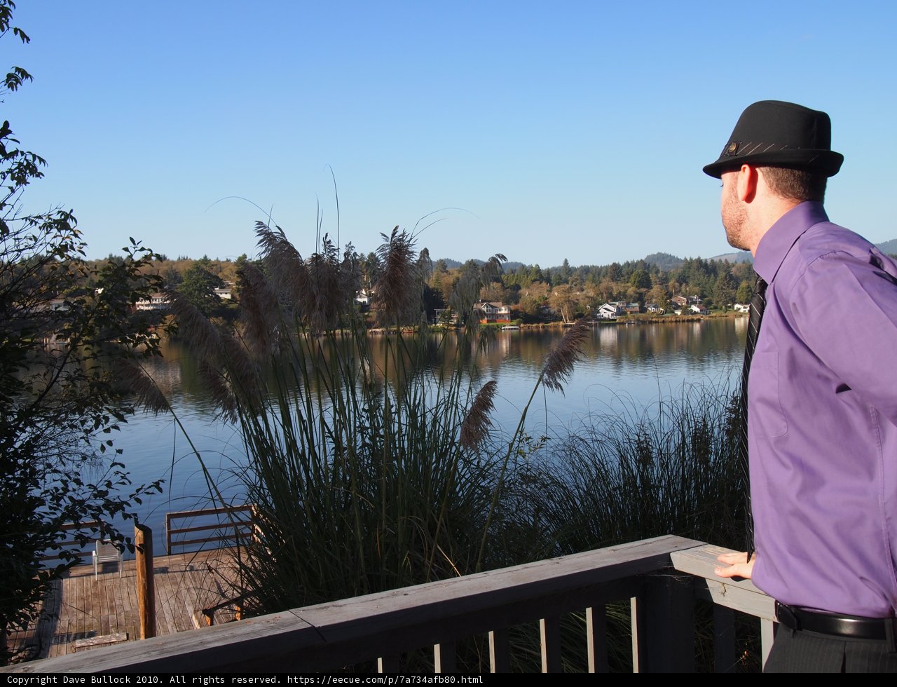 Stylish Man in Fedora Hat by the Waterfront