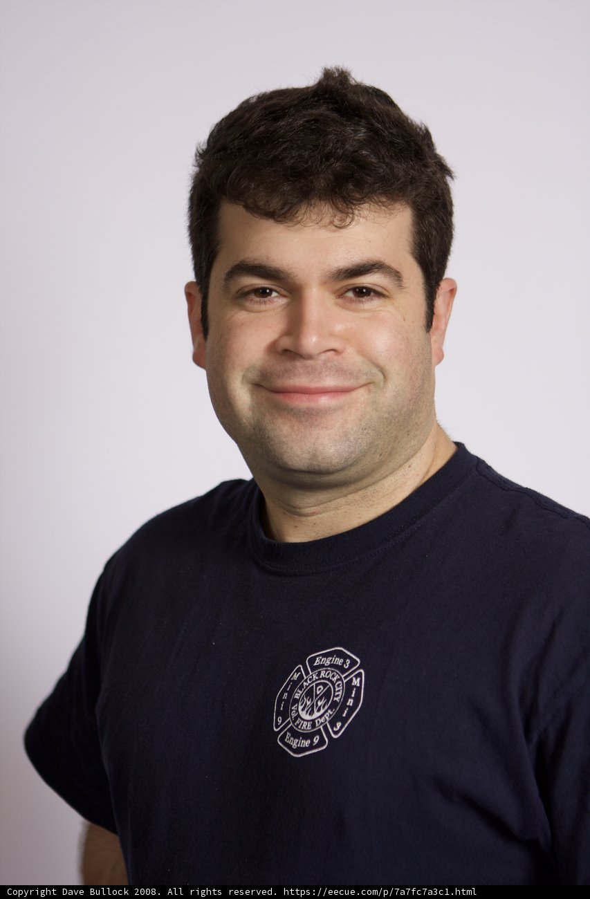 Smiling Man in Blue T-Shirt