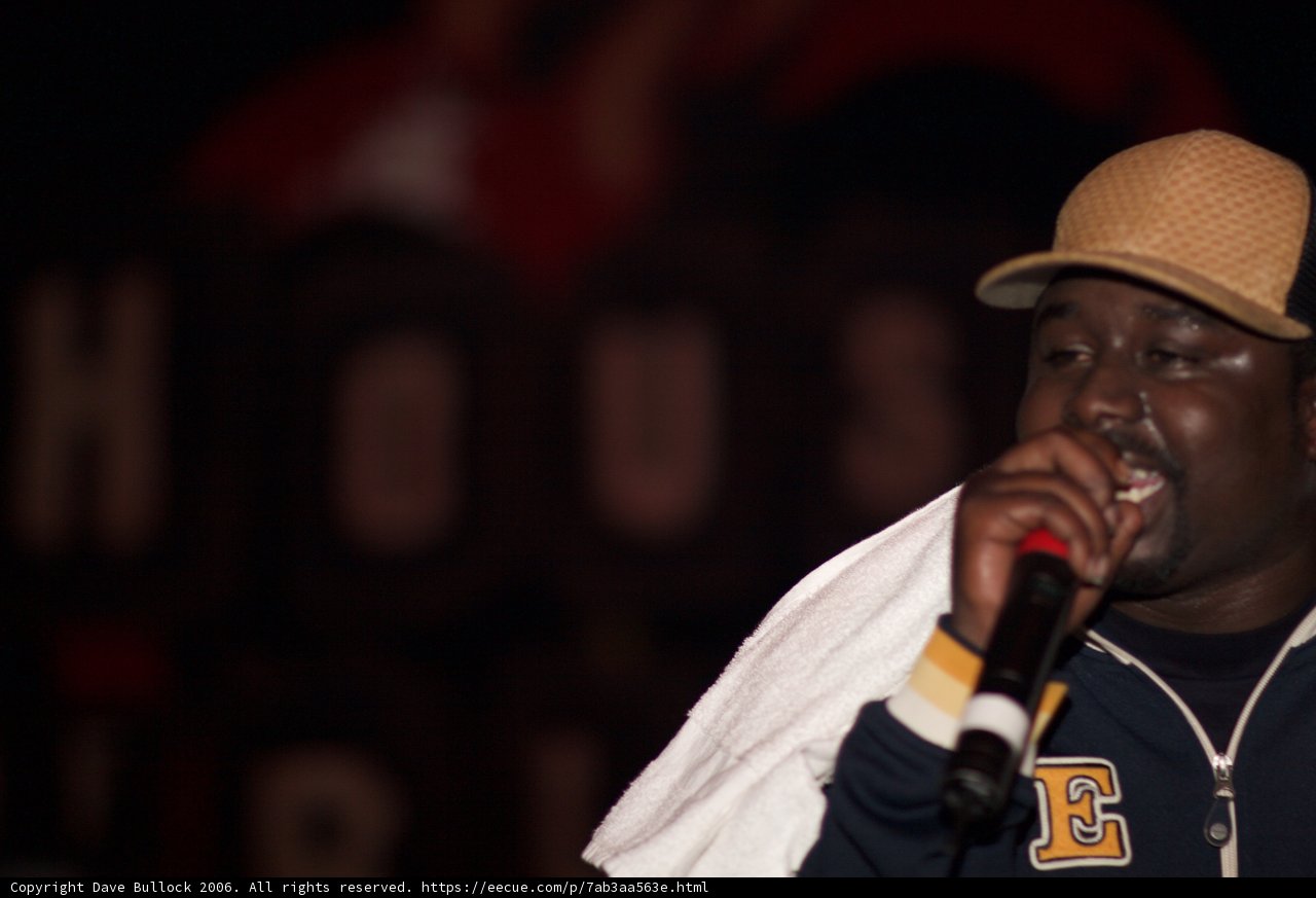 Mic in Hand, Hat on Head