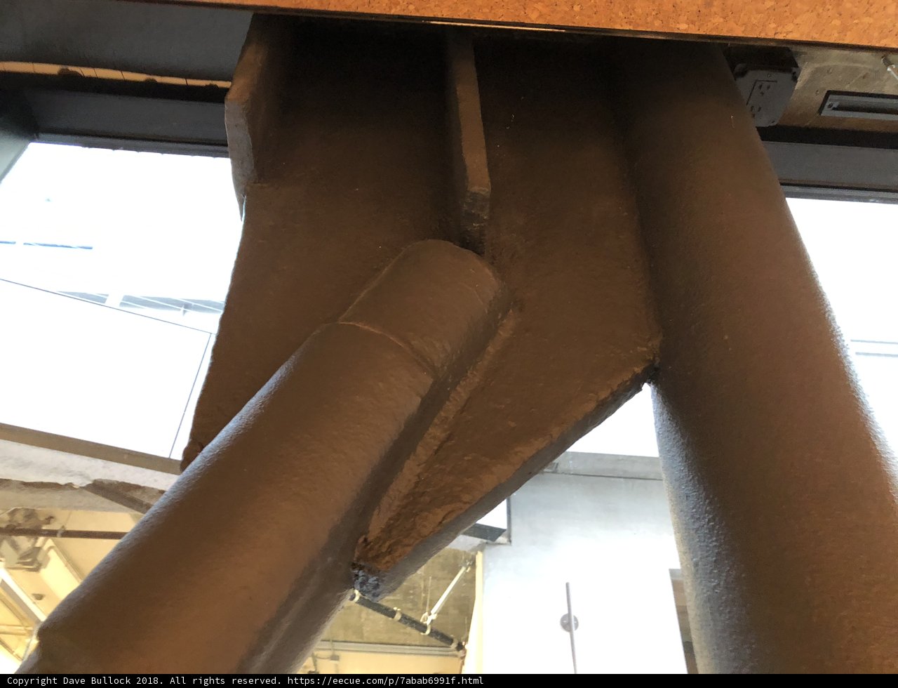 A Rusty Metal Pipe with Attached Pipe