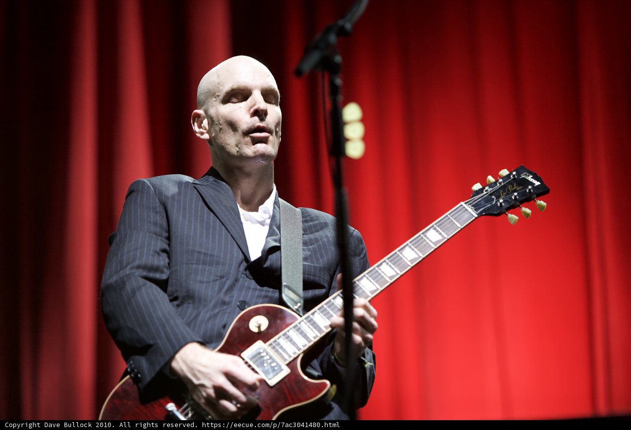 The Bald Guitarist Rocks the Stage