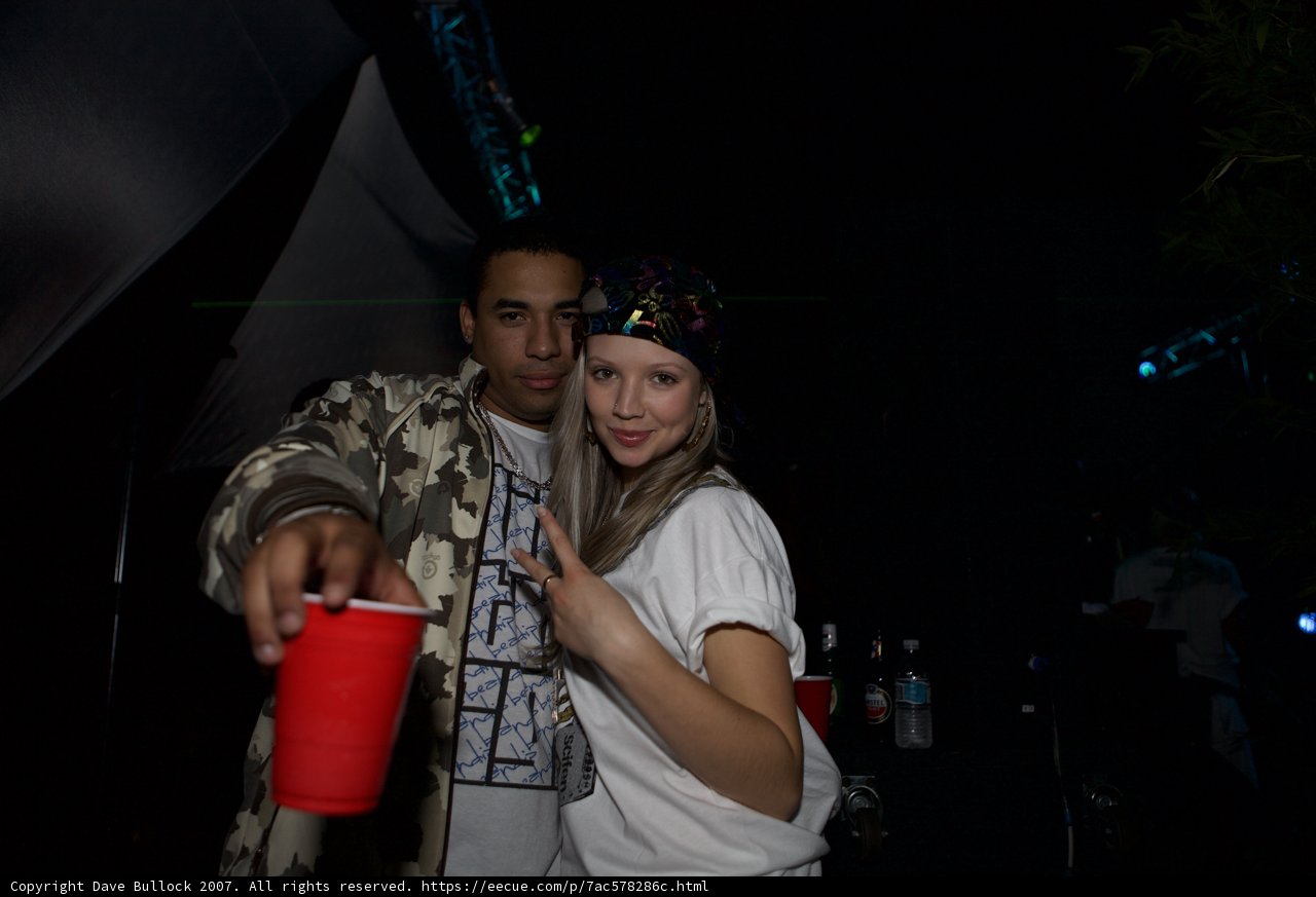 Party Couple Posing With Cups