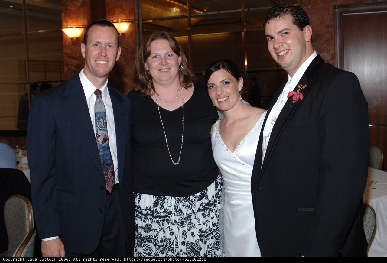 Joyful Wedding Reception Celebration with Two Couples