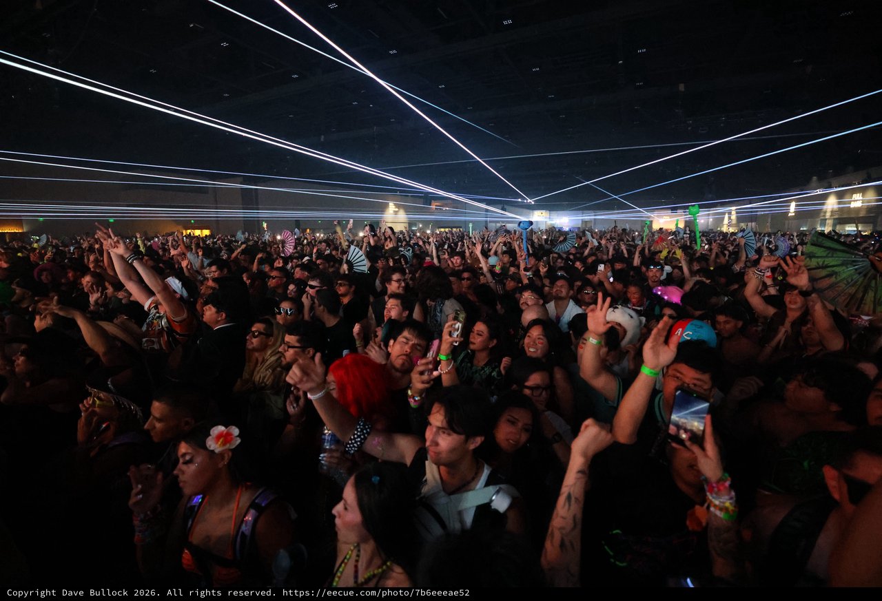 Massive Crowd Surges Under Laser Light Show