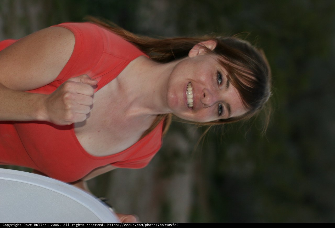 Joyful Young Woman in Red Top Outdoors