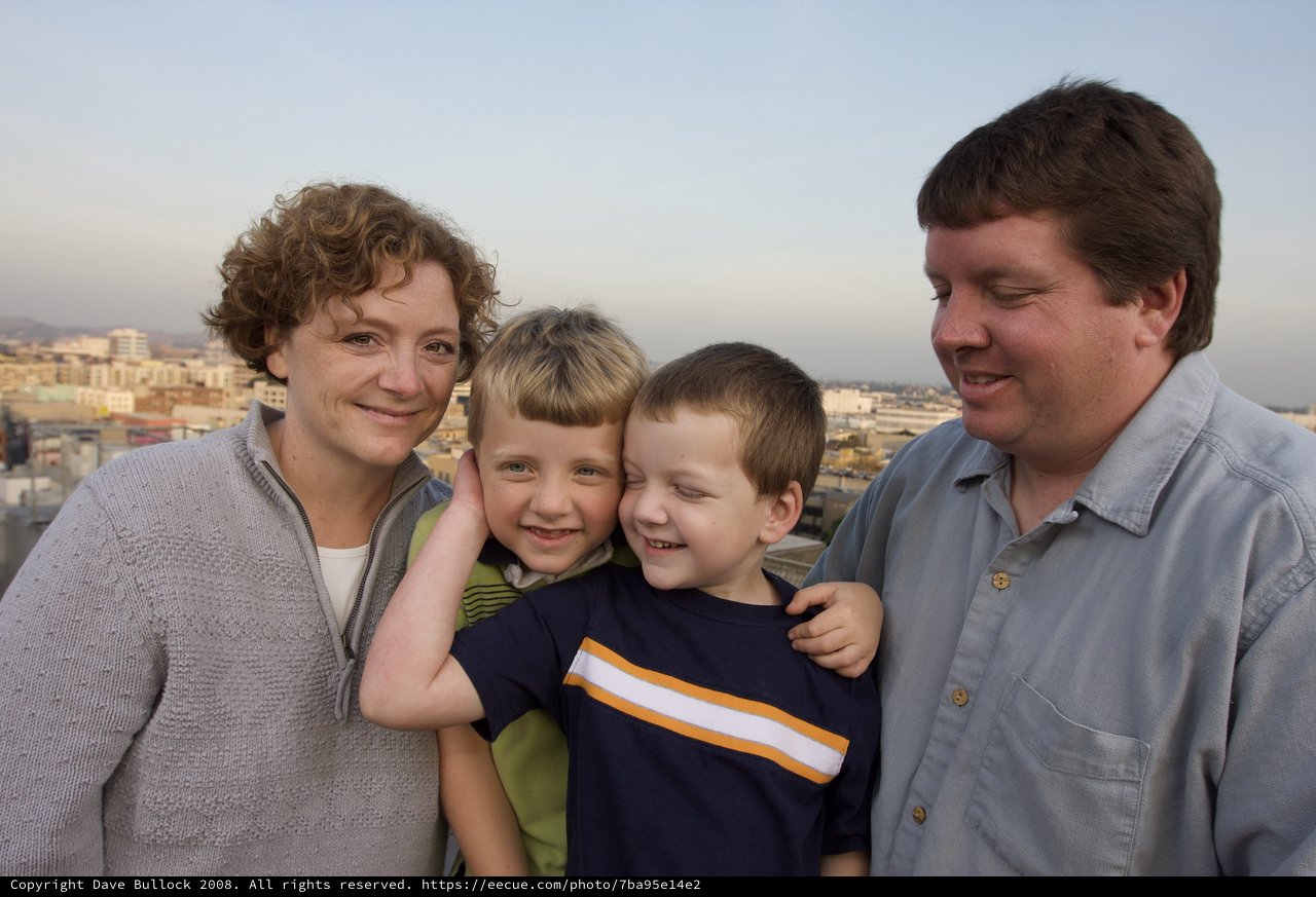 Family Portrait on Urban Rooftop at Dusk