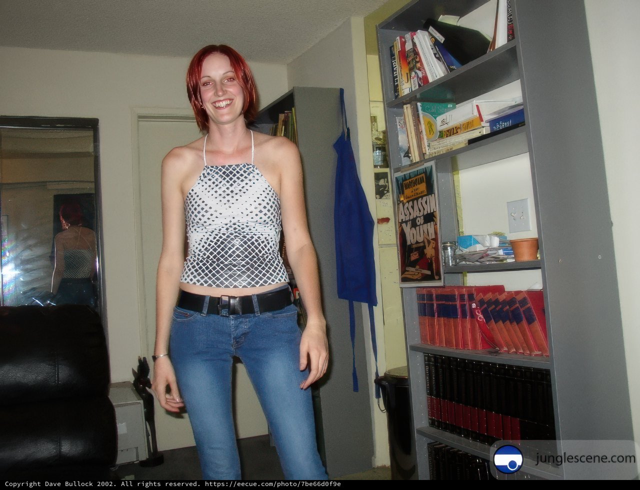 Redheaded Woman Standing in a Cozy Library