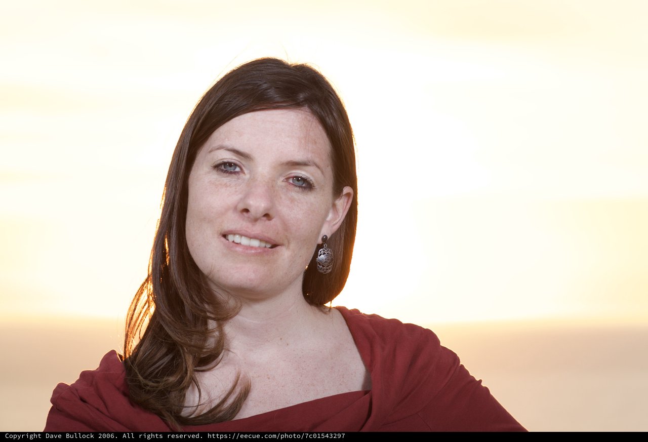 Golden Hour Portrait of a Smiling Woman at Sunset