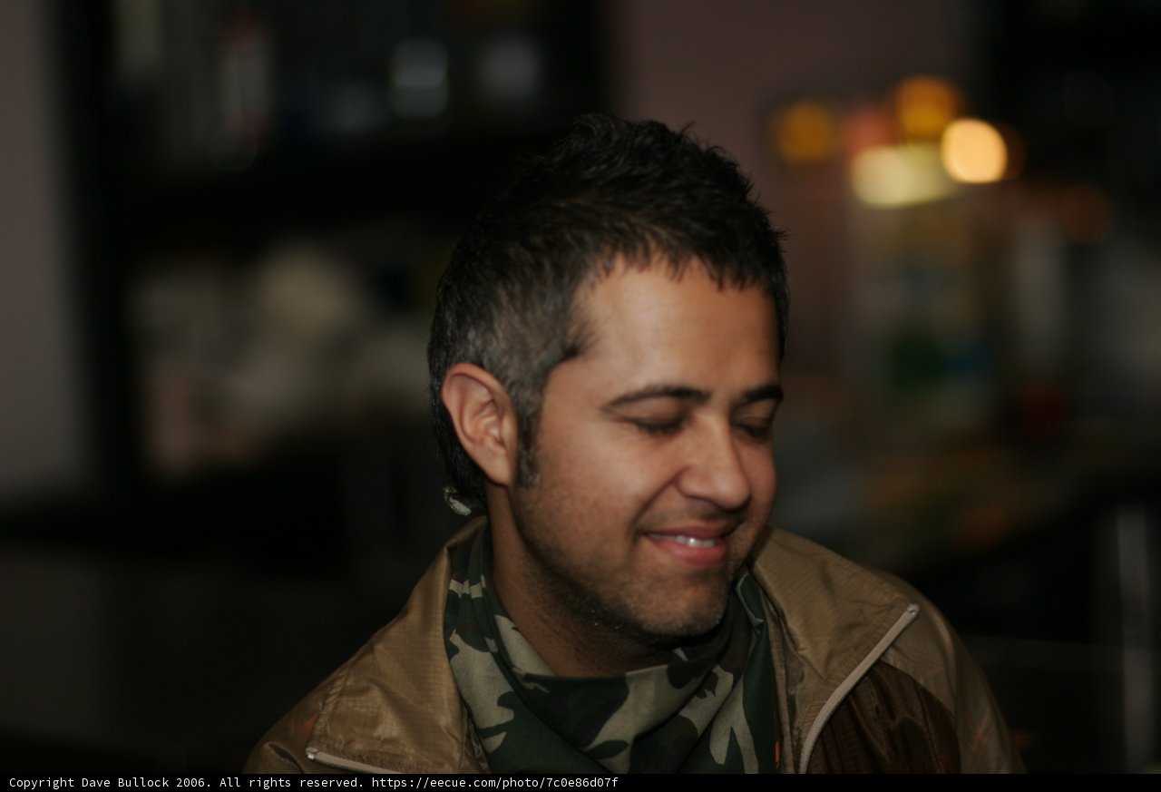 Smiling Man in Military Jacket