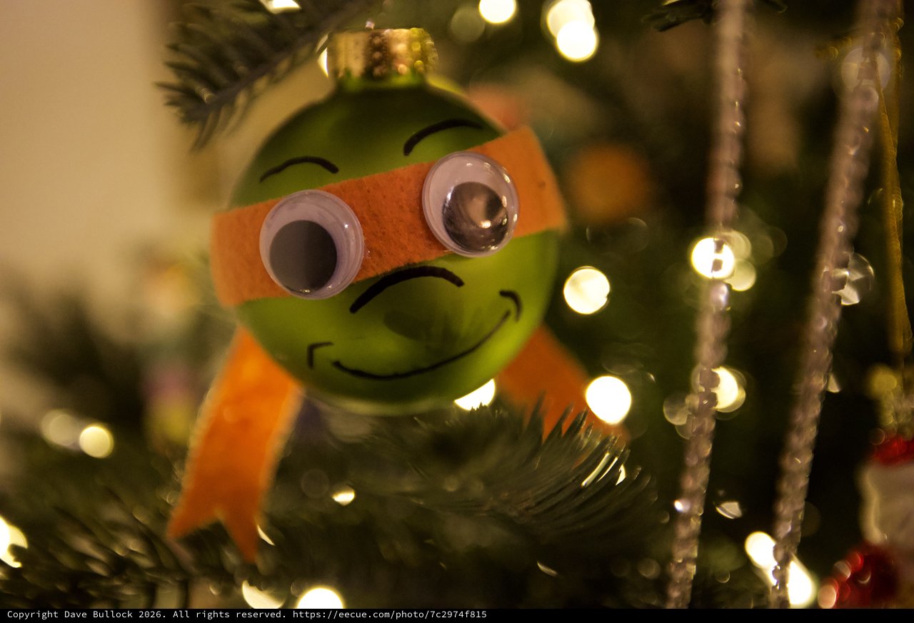 Festive Green Christmas Ornament with Orange Scarf