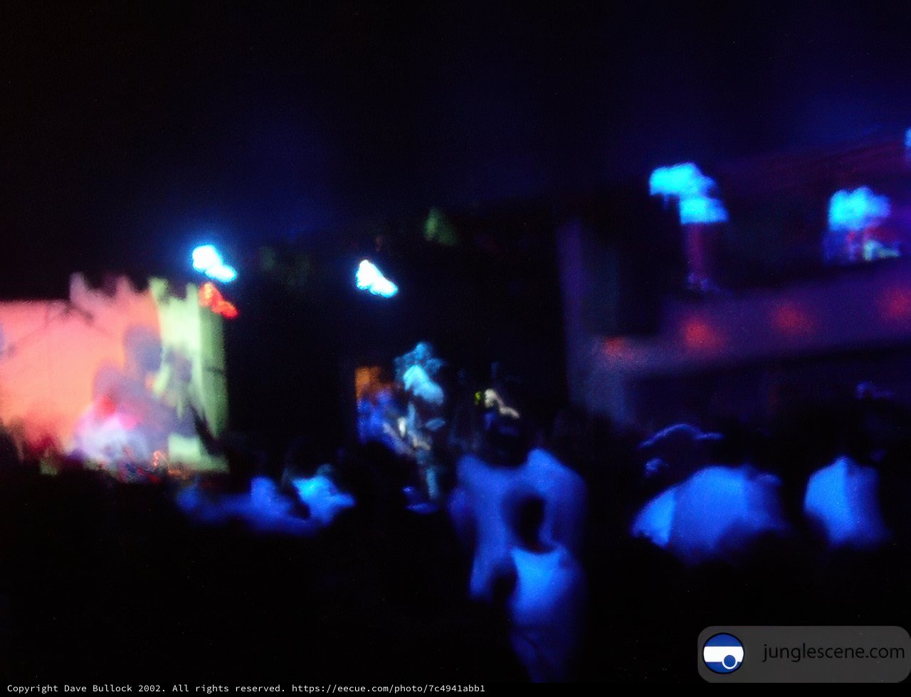 Blue-lit Nightclub Concert Crowd