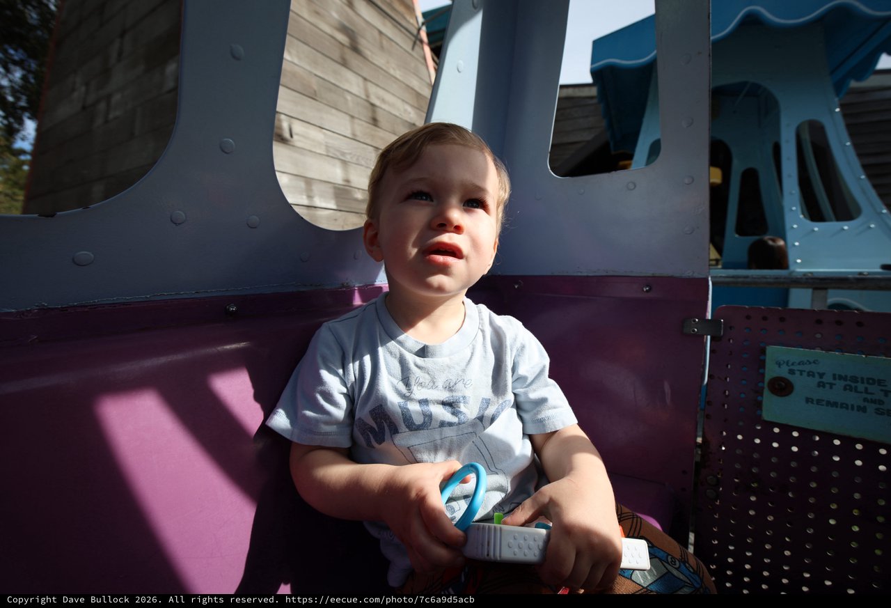 Toddler on Playground Equipment at Golden Hour