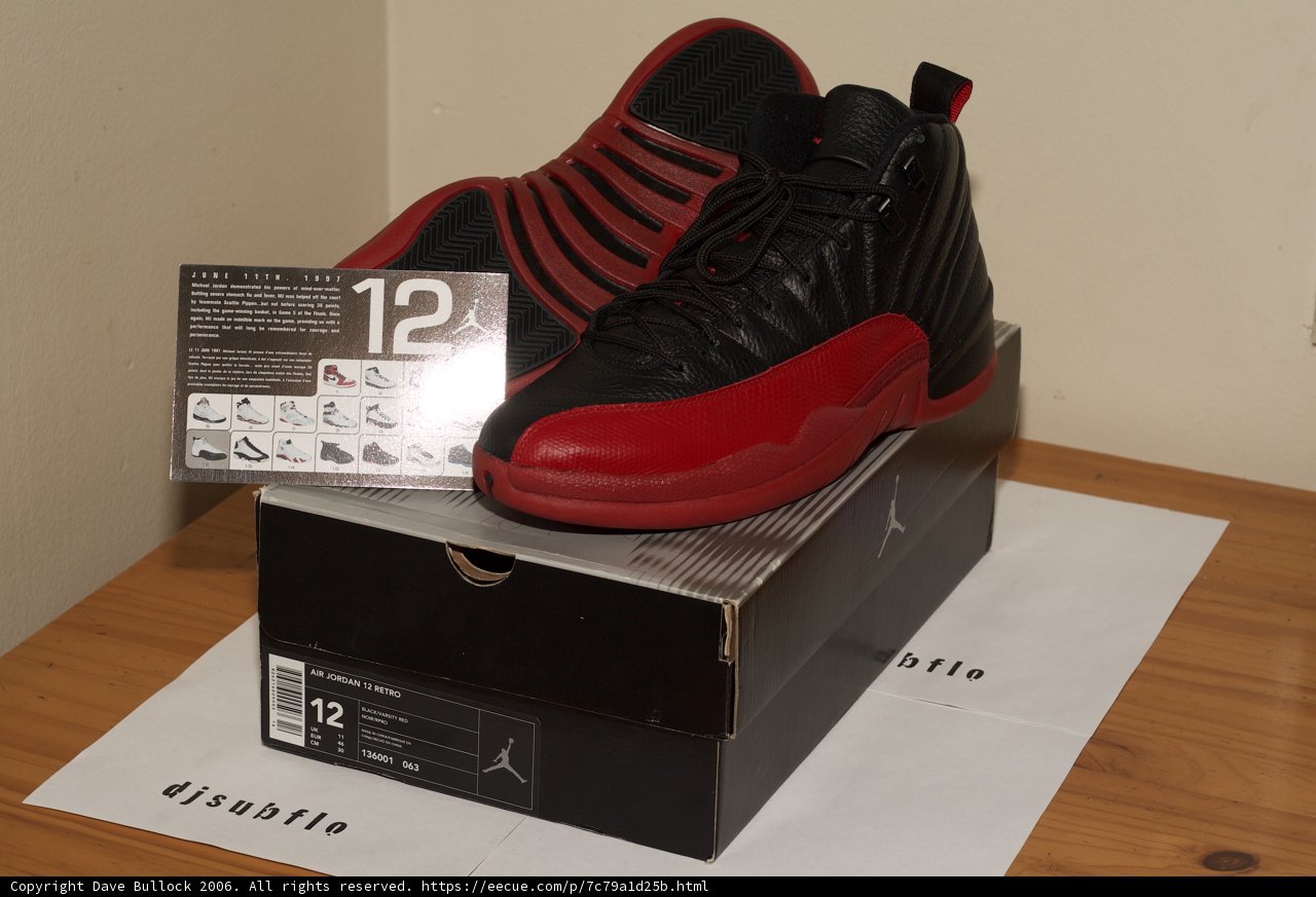 Red and Black Shoes on a Wooden Table