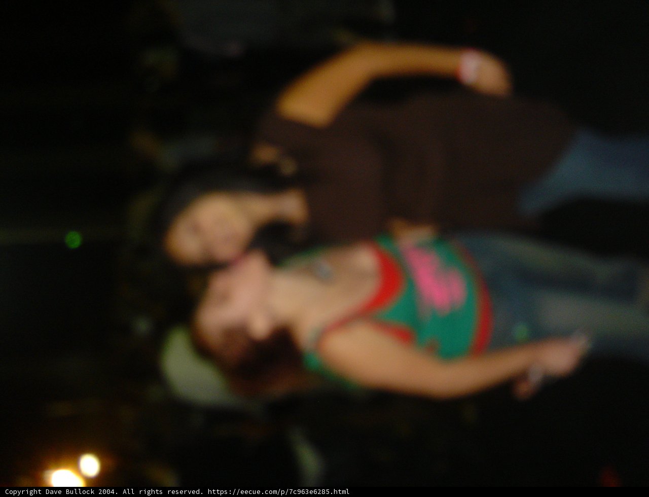 Blurred Kiss in the Night Club