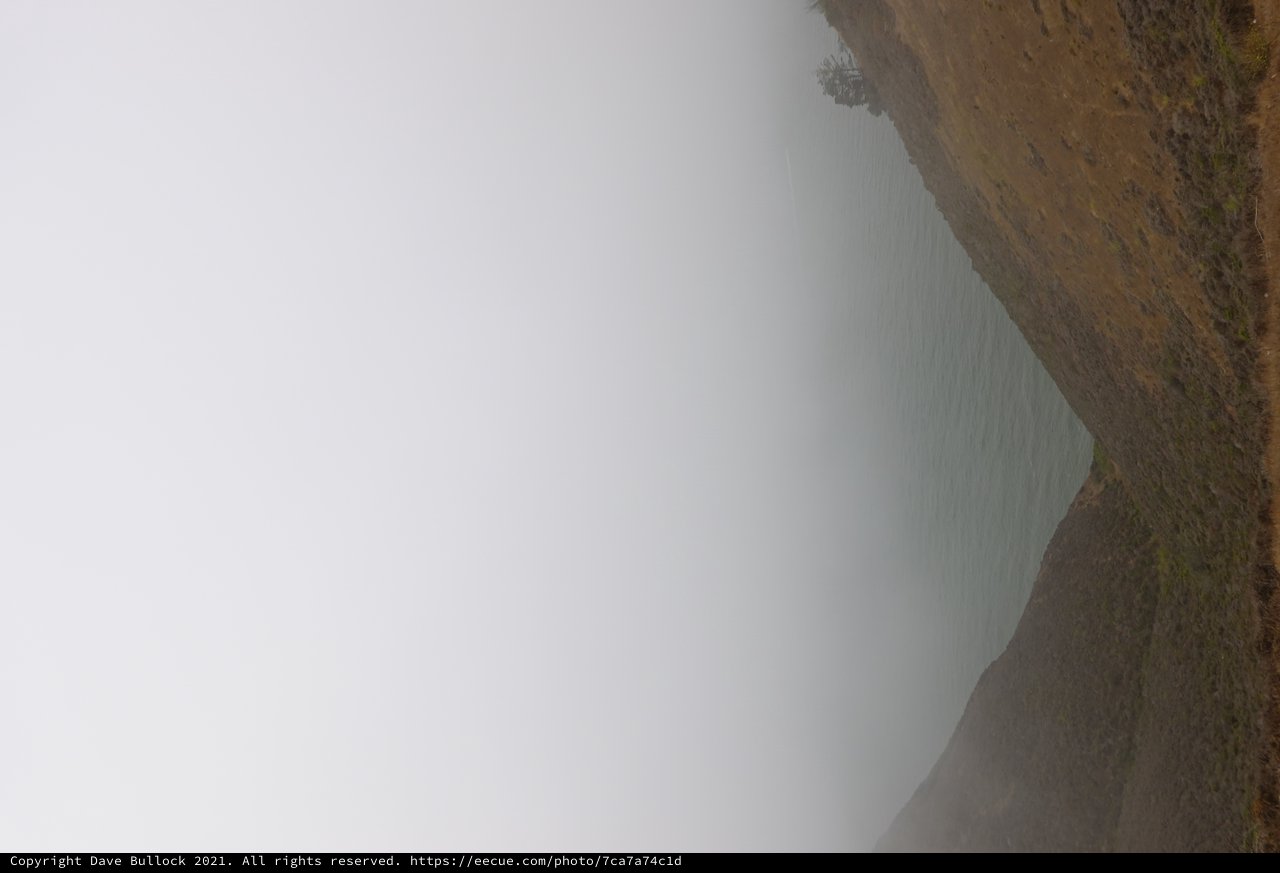 Misty Coastal Hills Through Valley View