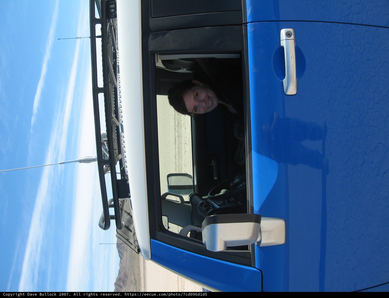 Smiling Woman in Blue Toyota FJ Cruiser Desert