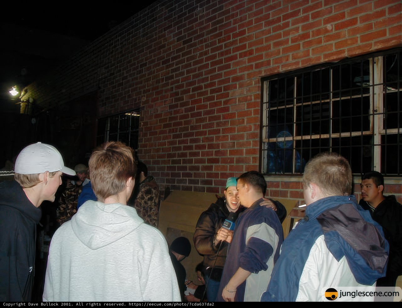 Nighttime Gathering in Urban Brick Alley