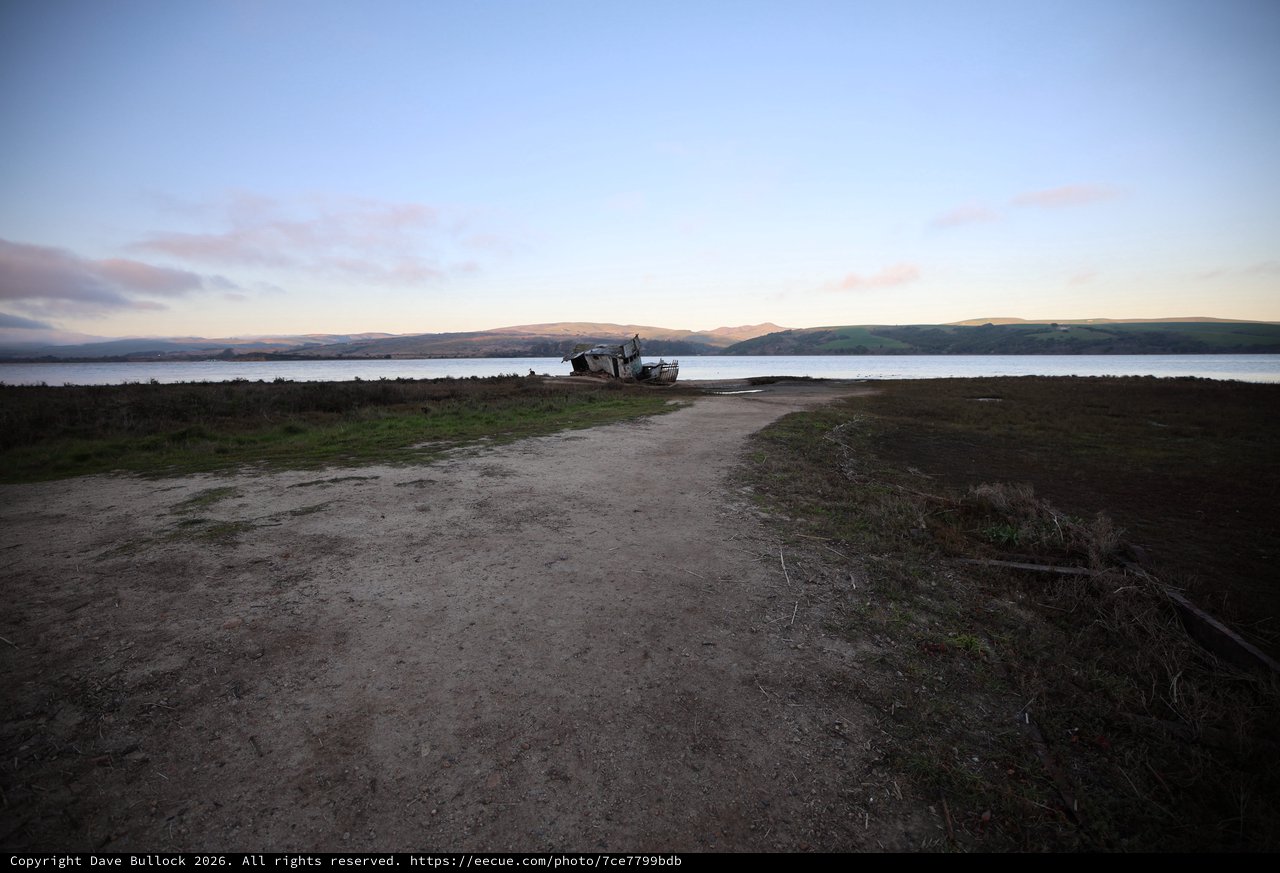 Abandoned Boat at Twilight on Coastal Estuary