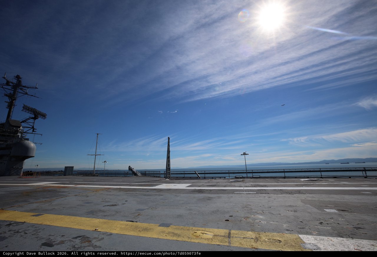 Aircraft Carrier Flight Deck Under Blue Skies